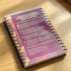 A purple and white spiral-bound guide titled Enhance your reading of the Bible with this beginner's guide to each book.
