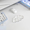 A white cloud-shaped ergonomic wrist rest set for a keyboard and mouse is shown on a white desk surface.