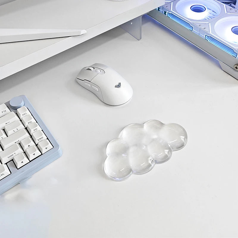 A white cloud-shaped ergonomic wrist rest set for a keyboard and mouse is shown on a white desk surface.