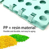 Light blue PP and resin folding board with multiple circular holes and a pile of yellow and green beads nearby