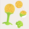 A silicone baby teether shaped like a strawberry, shown in yellow and green colors.