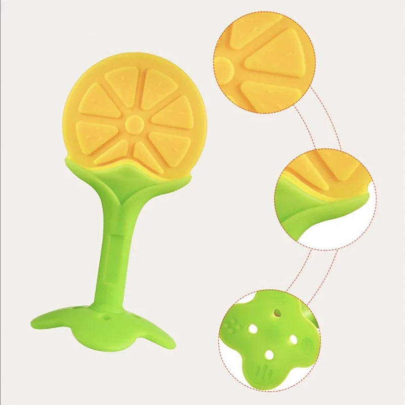 A silicone baby teether shaped like a strawberry, shown in yellow and green colors.