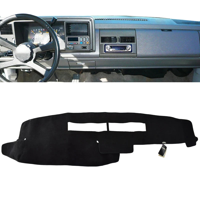 Black custom-fit dashboard cover for a truck or SUV interior.
