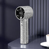 A silver sparkling diamond pattern portable fan with an LED display is shown on a dark surface.