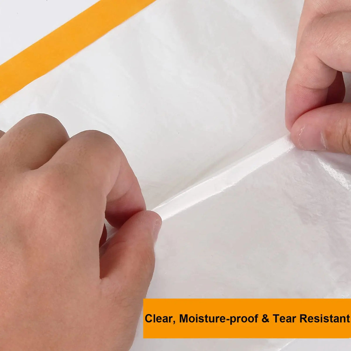 Hands are applying a clear, moisture-proof, and tear-resistant plastic sheeting to a surface.