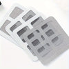 A stack of white mesh filters used as disposable shower drain hair catchers for sinks and floor drains.