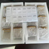 A set of five square glass spice jars with bamboo lids and labels for various herbs and spices are displayed in a white box.