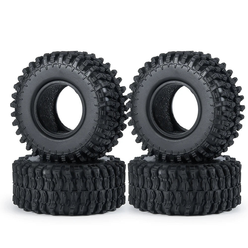 A pair of black rubber mud terrain tires for Axial SCX24 and TRX4M