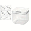 A clear plastic container with an airtight lid holds various laundry pods and sheets.