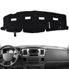 Black custom-fit dash cover for a Dodge Ram truck interior.