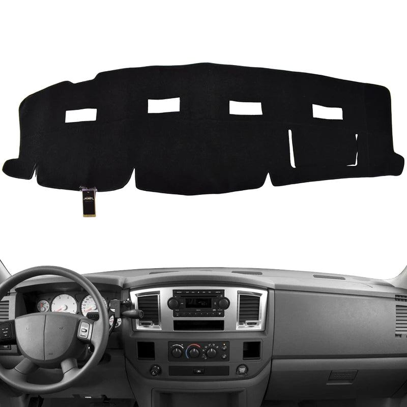 Black custom-fit dash cover for a Dodge Ram truck interior.