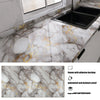 Marble effect peel-and-stick wallpaper featuring gray marble with gold veining