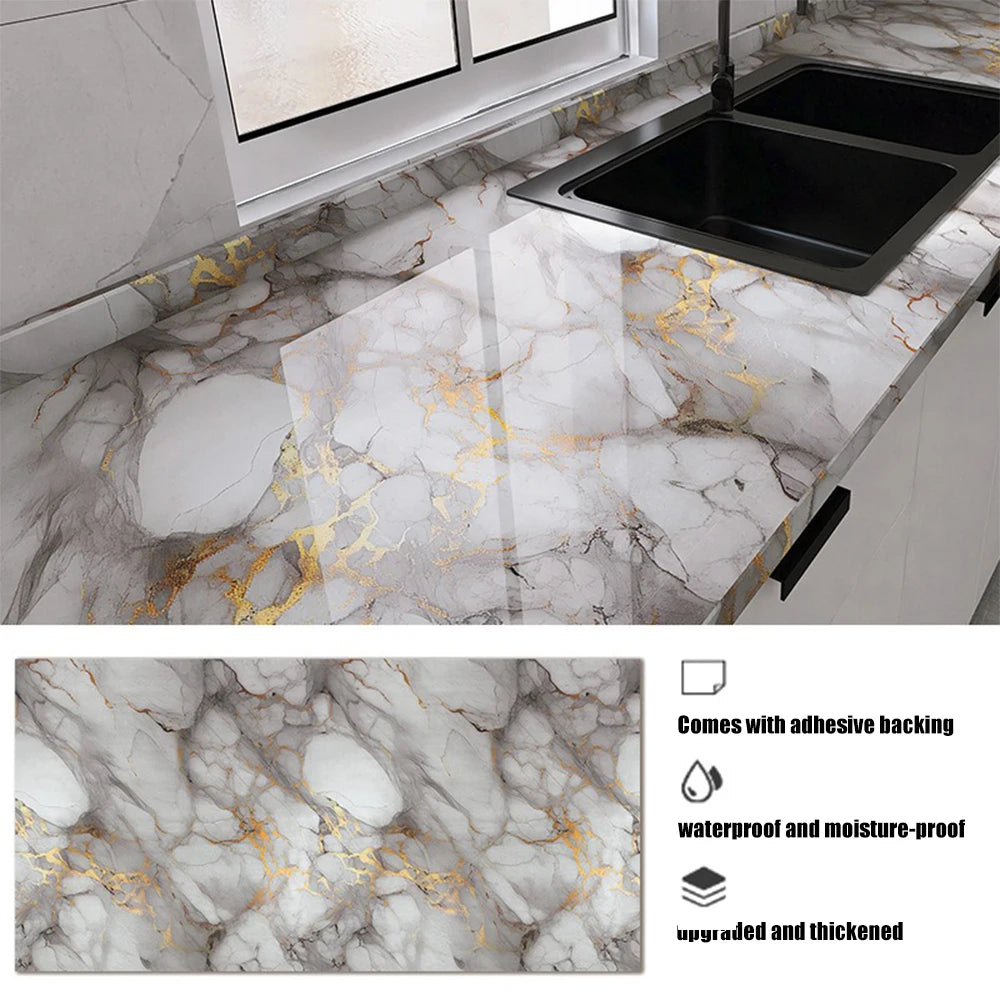 Marble effect peel-and-stick wallpaper featuring gray marble with gold veining