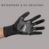 A close-up of a black waterproof and oil resistant work glove worn on a hand.