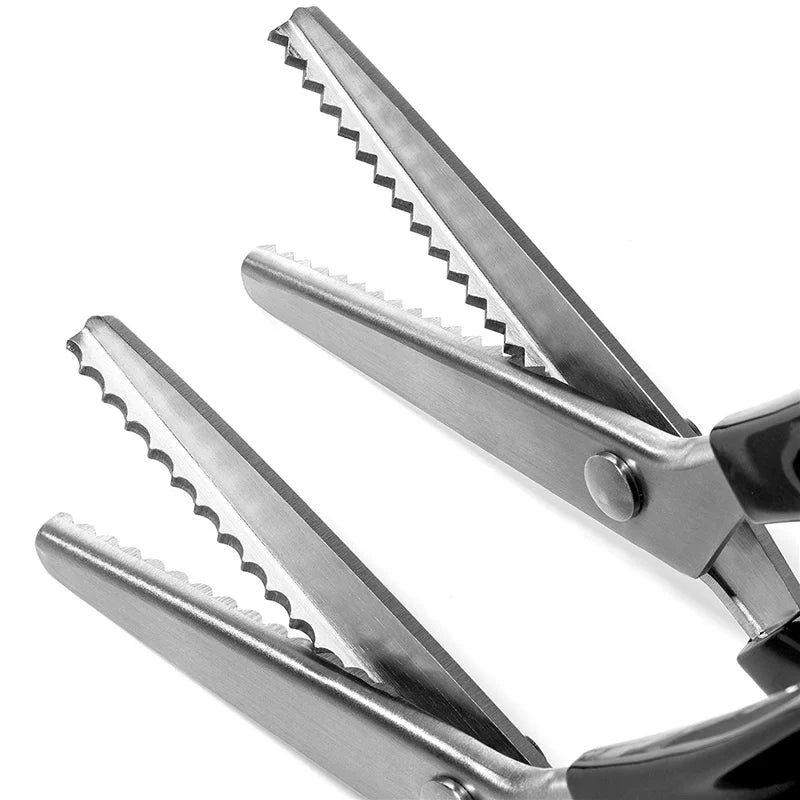 A pair of silver professional pinking shears shown in a close-up view.