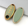 A light green TPU car key case cover with a gold finish and three key slots for Nissan and Infiniti models.