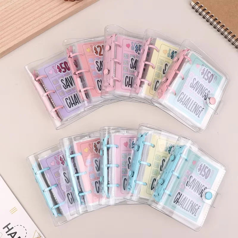 A set of clear plastic envelopes containing cash savings challenge slips in pink, purple, and blue colors.
