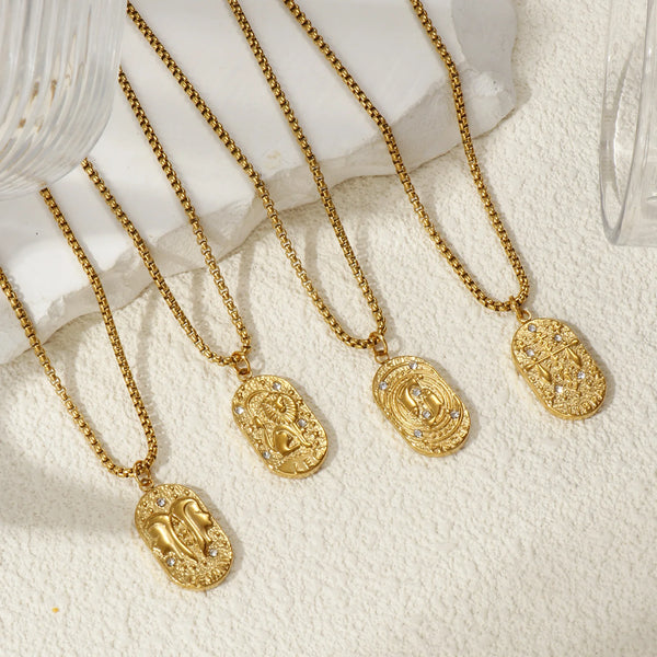 A collection of gold-plated constellation pendant necklaces displayed on a white textured surface.