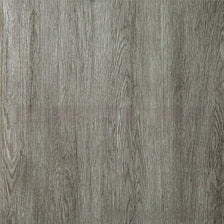 Close-up texture of gray wood grain vinyl flooring tiles with vertical grain lines.