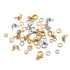 A collection of gold and silver jewelry making components including lobster clasps, jump rings, and crimps.