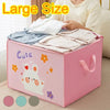 A pink storage box decorated with cute bear and flower patterns, holding folded white clothing items.