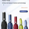 A collection of three-fold umbrellas in various colors including black, blue, red, green, and silver.