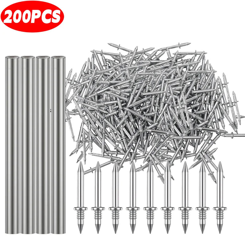 A pile of silver double head wood nails and a set of single pointed nails.