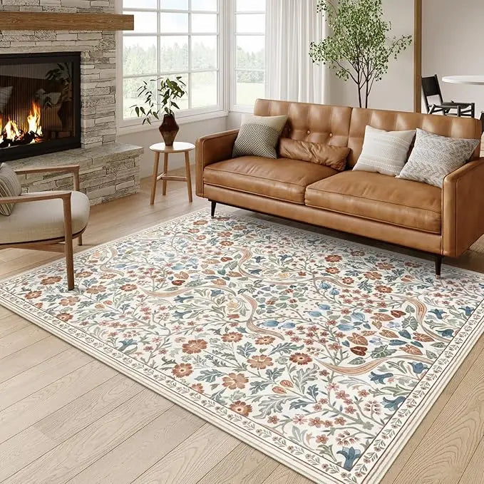 A rectangular floral vine pattern carpet mat featuring soft beige and blue tones on a light wood floor.