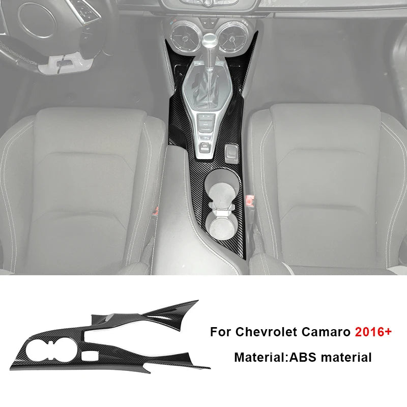 Carbon fiber interior trim kit for Chevrolet Camaro featuring a custom steering wheel cover and console piece.