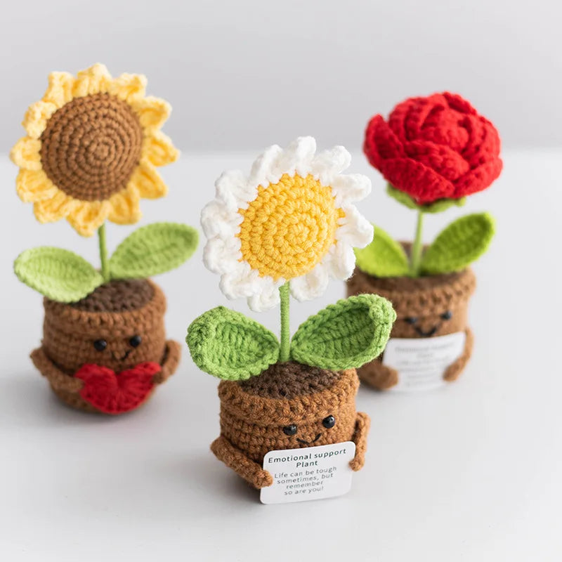 Handmade crochet positive energy plant decor featuring three colorful flowers in terracotta pots