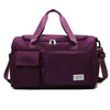 A deep purple large capacity travel duffel bag with a separate shoe compartment and carrying straps.