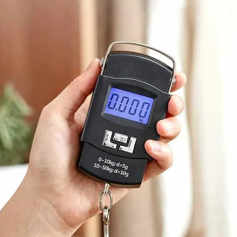 A hand holds a black portable digital luggage scale with an LCD display showing 0.000 kg.