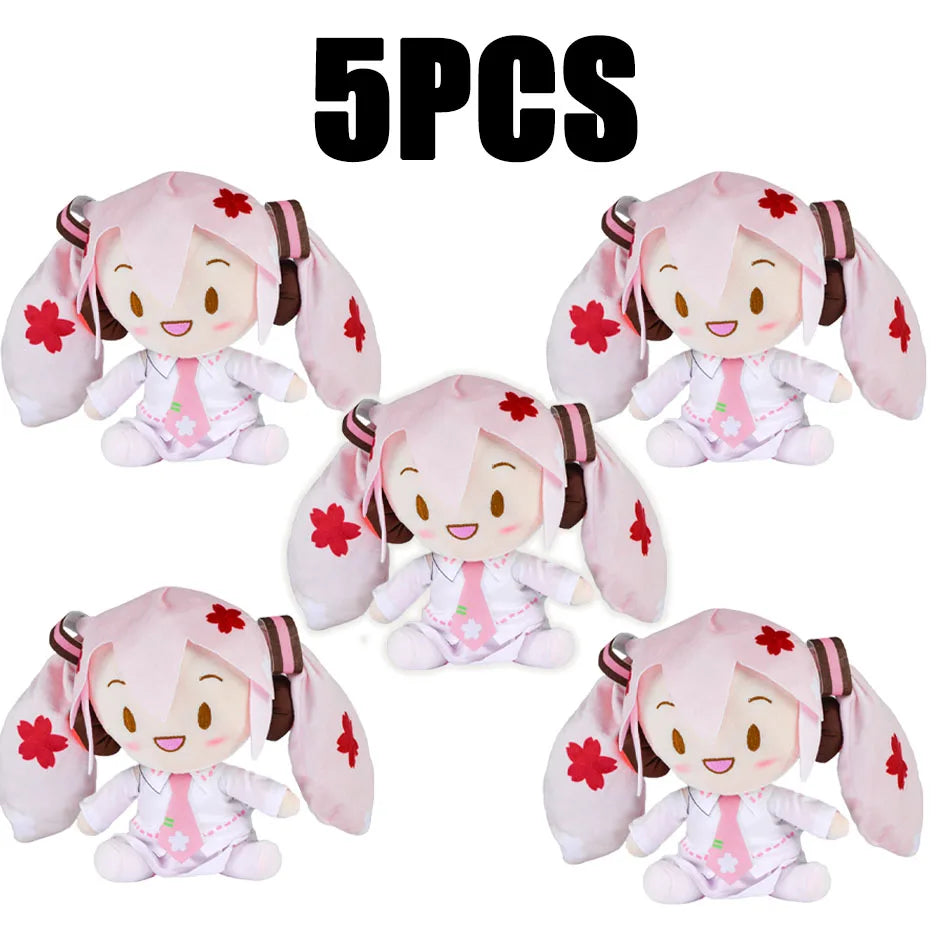 Five soft pink Hatsune Miku plush dolls with large ears and detailed features