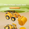 A yellow diecast construction vehicle set featuring an excavator and bulldozer after multiple impact tests.
