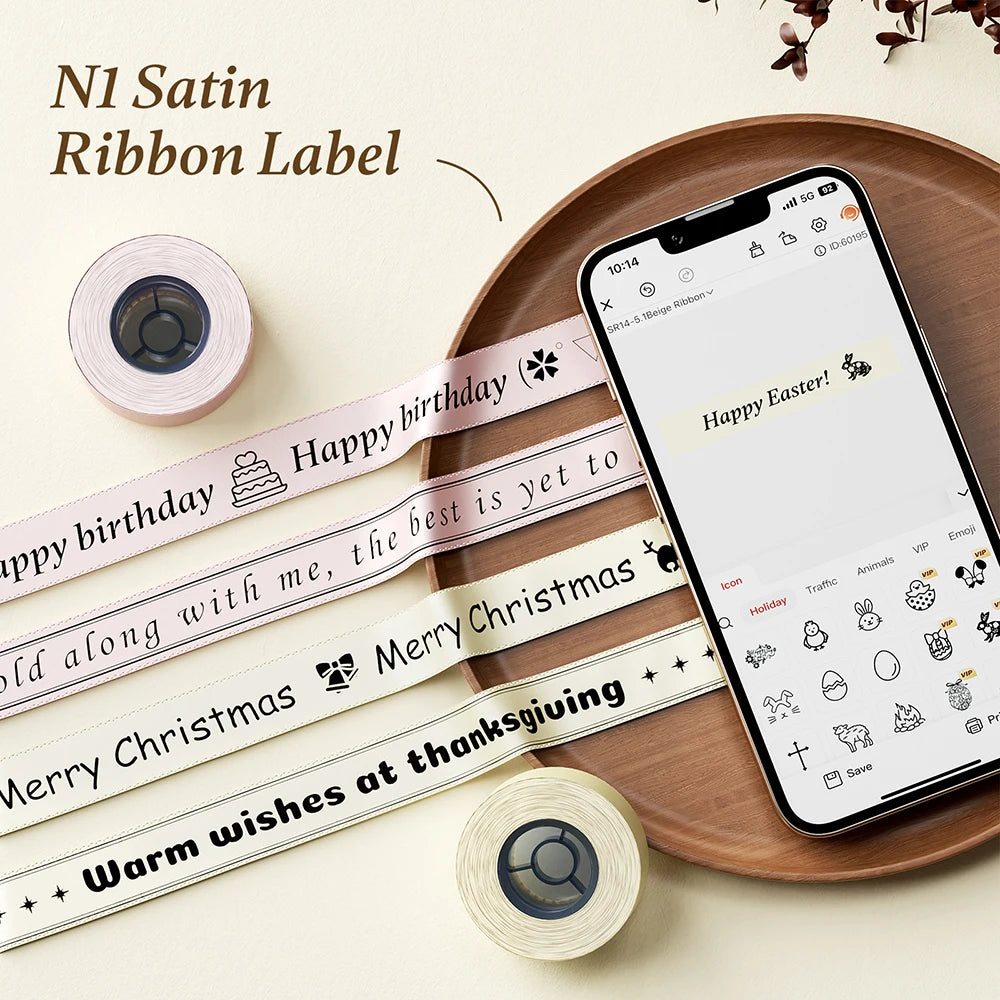 Rolls of satin ribbon labels for an N1 label printer showing various holiday and birthday messages