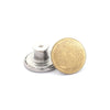 A round, gold-colored button with a silver mounting base.