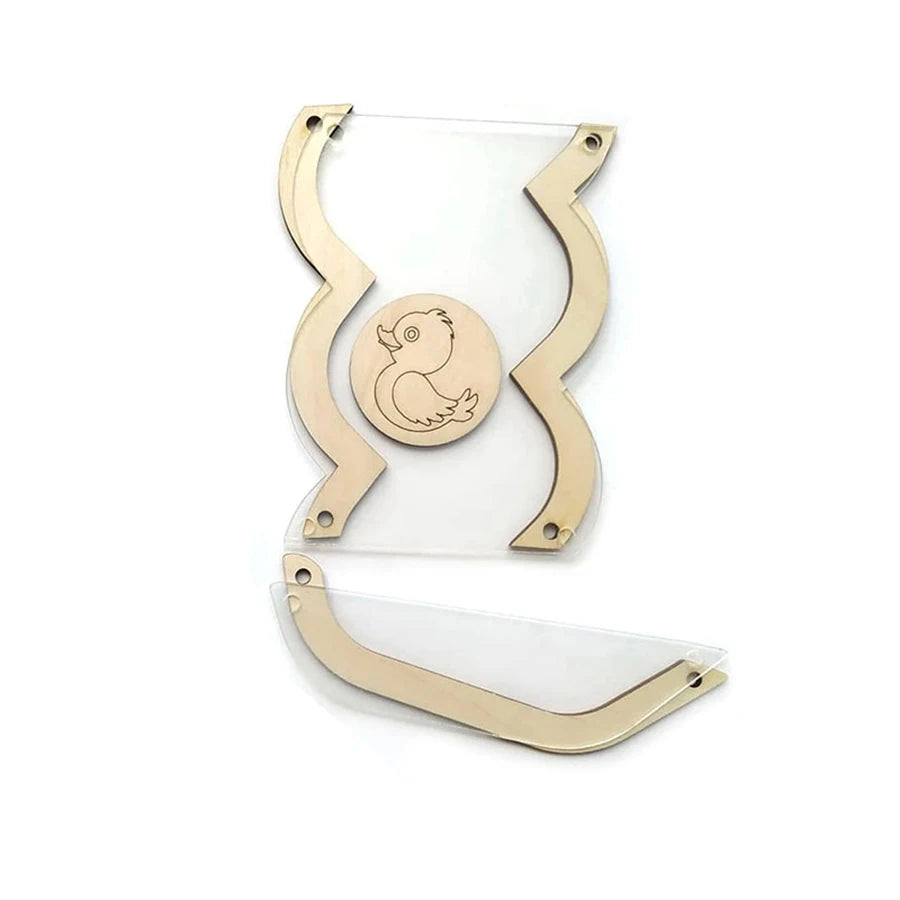 A set of Montessori busy board DIY parts featuring a wooden silhouette of a bird on clear acrylic pieces.