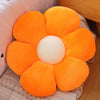 An orange and white lifelike sunflower plush pillow with soft furry texture.