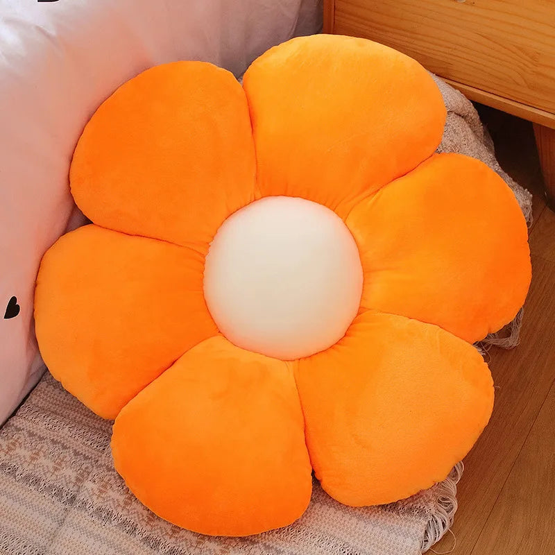 An orange and white lifelike sunflower plush pillow with soft furry texture.