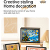 A collection of framed paintings featuring Van Gogh and classic art styles displayed on a wooden surface.