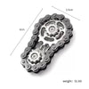 A close-up view of a black iridescent sprocket fidget spinner hand spinner with dimensions marked.