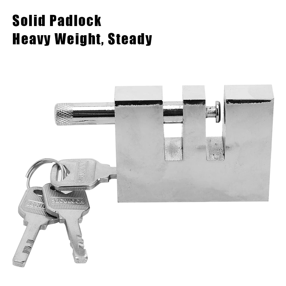 A silver solid padlock with a key and a set of keys, designed for car anti-theft protection.