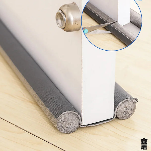 A close-up view of a door and window sealing strip being installed on a white door frame, showing the metal fitting and foam 