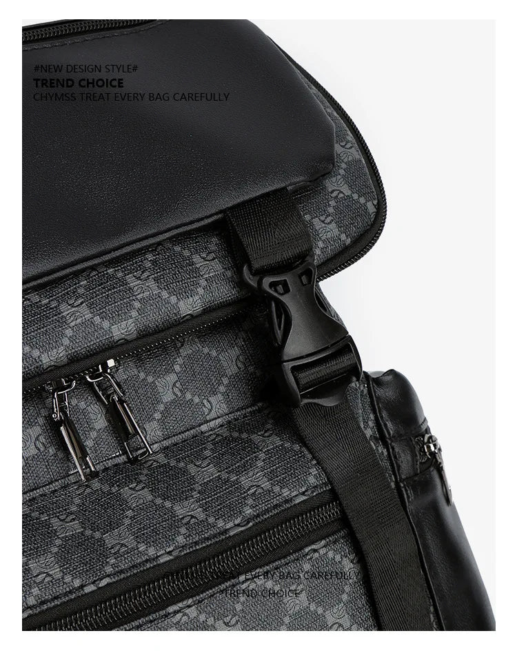A close-up of a black PU leather backpack featuring a subtle gray monogram pattern and silver zippers.