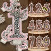 Pink rhinestone crown number candles for birthday cakes showing numbers 1 through 9