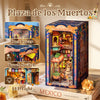 A boxed miniature book nook kit titled Plaza de los Muertos with an illuminated diorama inside.