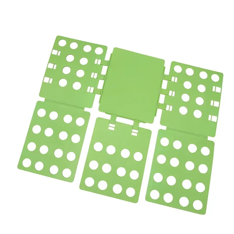 A set of green plastic folding boards used for organizing and folding clothes or t-shirts.