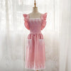 Pink ruffled cotton linen kitchen apron with lace trim displayed on a mannequin.