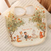 A soft cotton waterproof baby bib featuring an illustration of woodland animals and fruit on a light background.