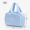 Light blue travel makeup bag with a wide opening shown from the front.